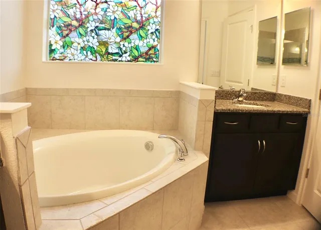 a bathroom with a bathtub and a sink