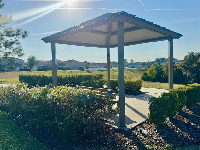 a view of a small yard in front of a house with a yard