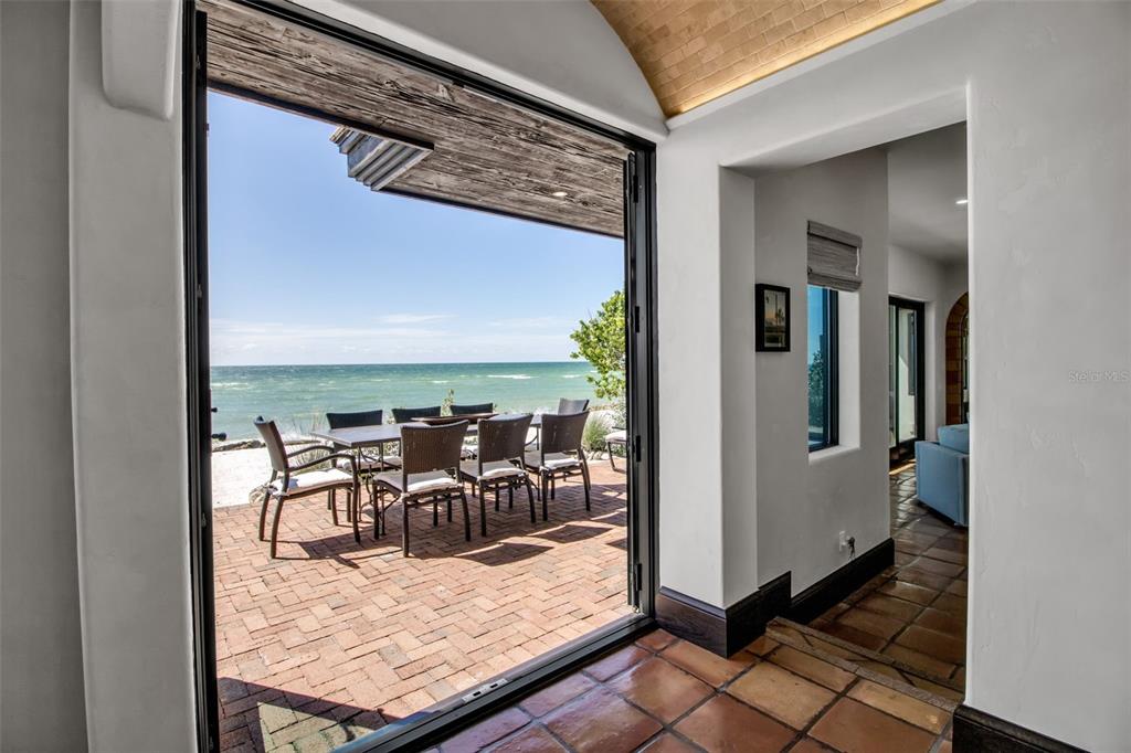 121 North Casey Key Road Osprey, FL 34229 - Photo 62 of 63 a view of a balcony and dining area