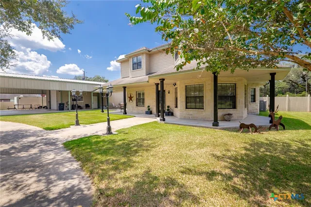 a view of a house with swimming pool and porch with furniture