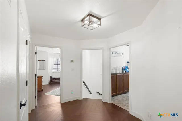 a kitchen with a sink appliances and cabinets