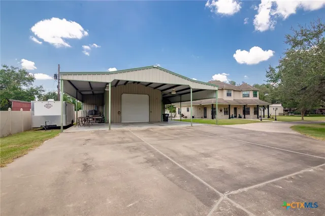 a living room with furniture a couch and wooden floor