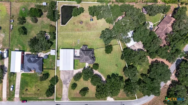 a view of a house with swimming pool and porch with furniture