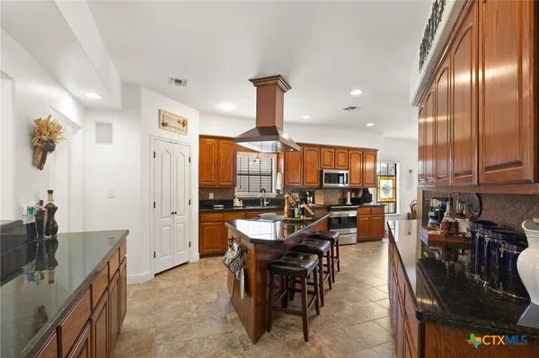 a view of a kitchen and dining room