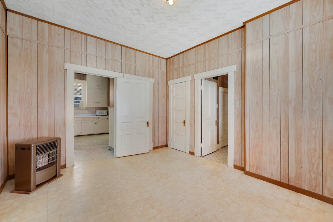 303 Vernon Street Taylor, TX 76574 - Photo 32 of 37 Bedroom, heating unit, and light floors