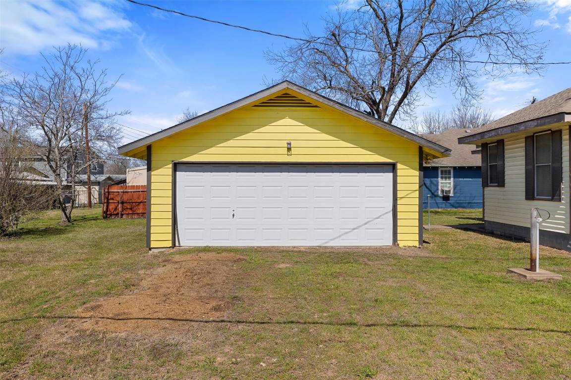 303 Vernon Street Taylor, TX 76574 - Photo 5 of 37 Detached garage featuring fence