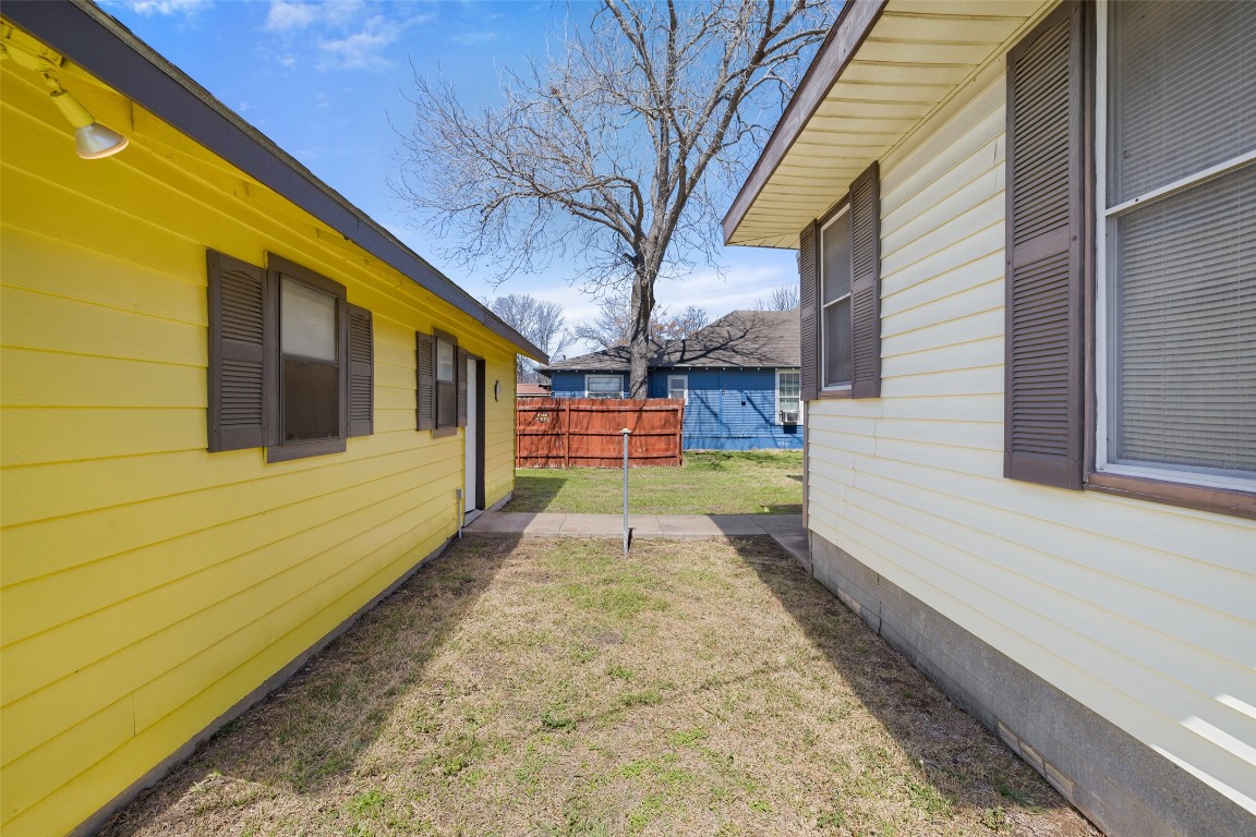 303 Vernon Street Taylor, TX 76574 - Photo 10 of 37 View of yard featuring fence