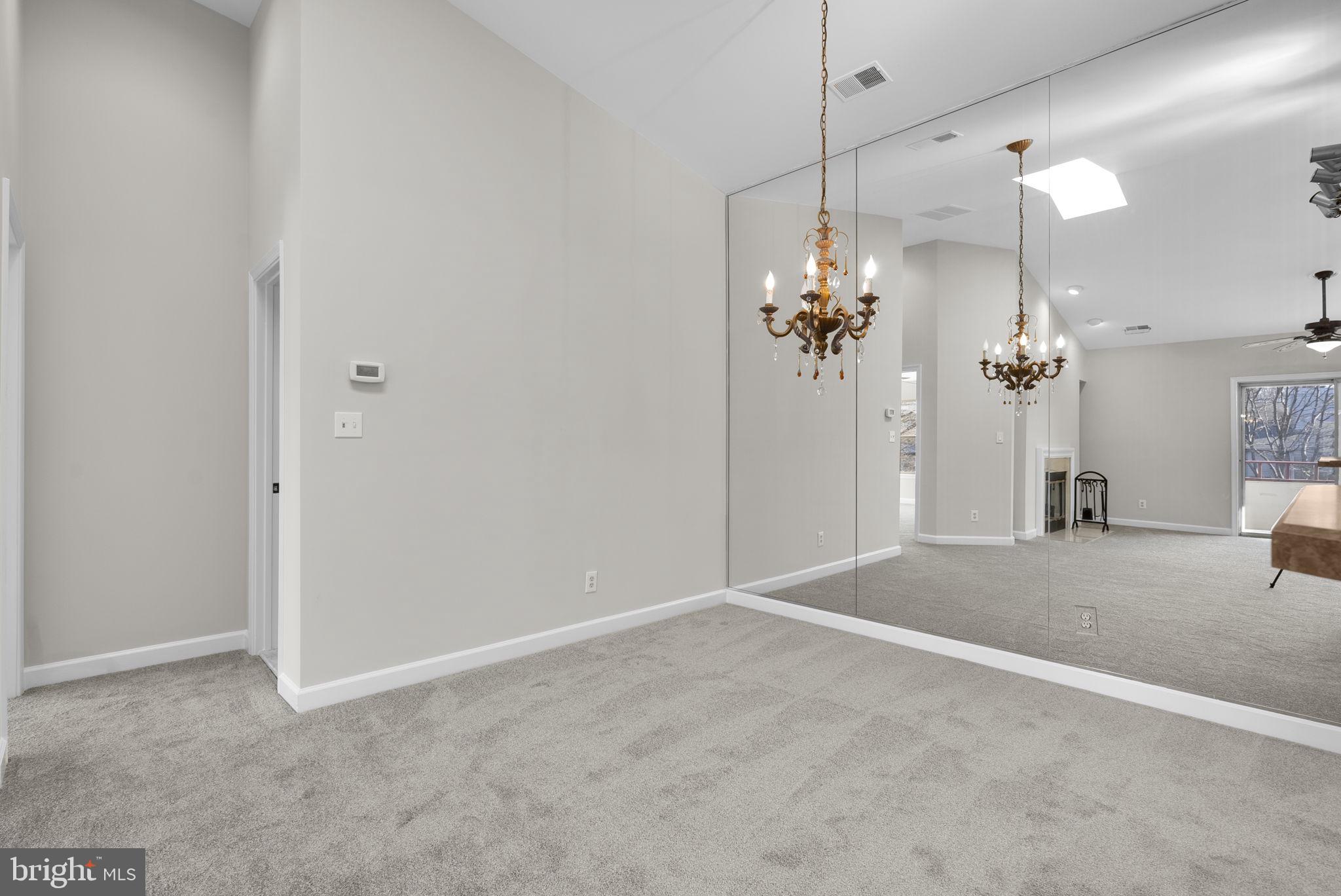 13701 Modrad Way, Unit 31 Silver Spring, MD 20904 - Photo 12 of 29 Dining Area with Mirrored Wall
