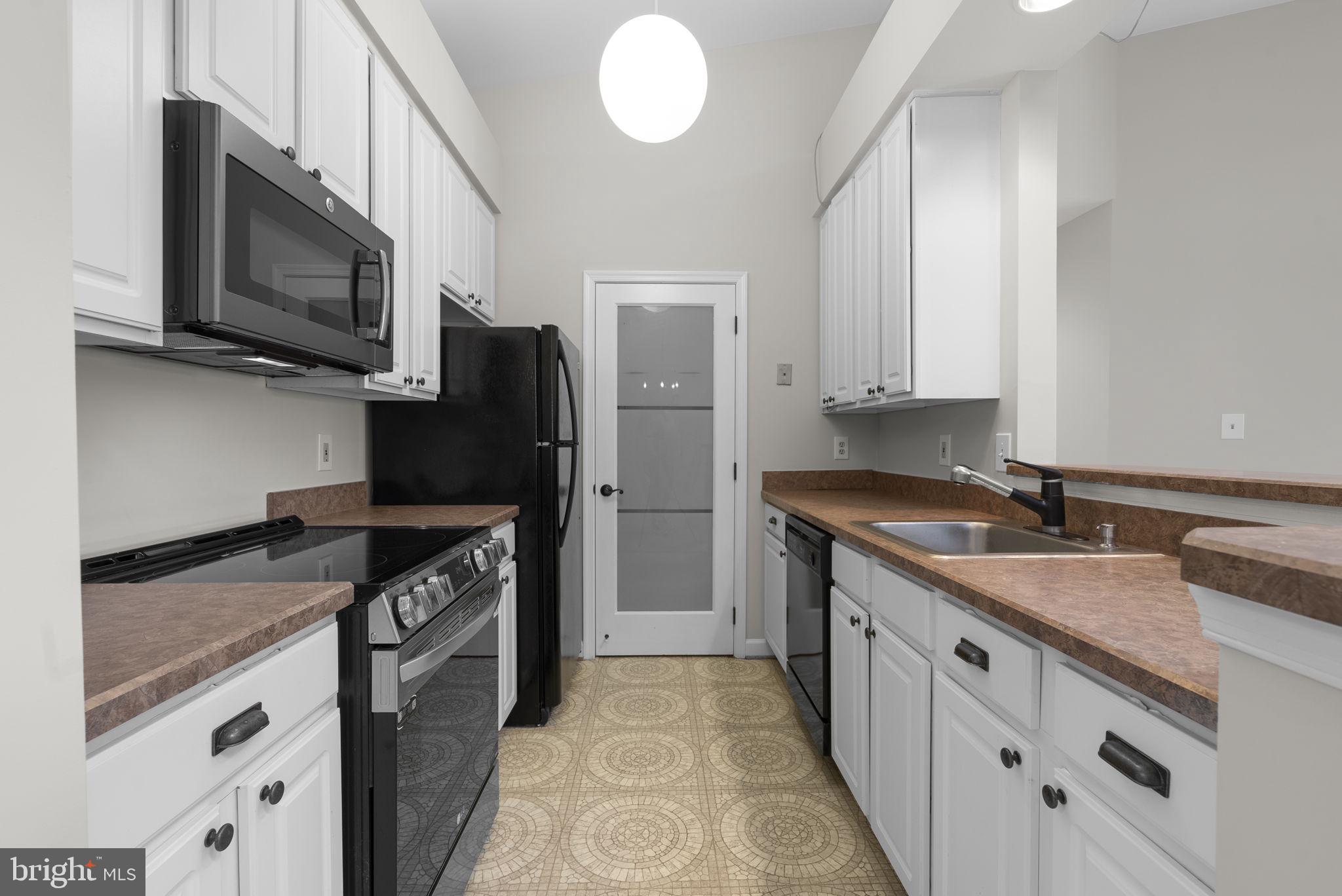 13701 Modrad Way, Unit 31 Silver Spring, MD 20904 - Photo 18 of 29 Kitchen and Uitlity/Laundry Closet