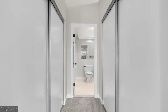 a bathroom with a sink vanity granite and a mirror