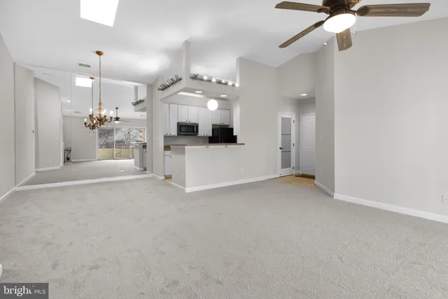 a view of a kitchen with a sink and a fireplace