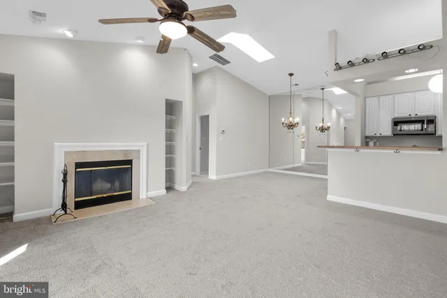 wooden floor fireplace and windows in a room