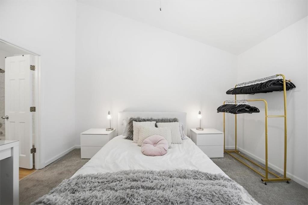 2215 Spring Walk Court Atlanta, GA 30341 - Photo 16 of 29 a bedroom with a bed and wooden floor