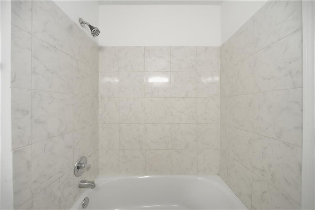 2215 Spring Walk Court Atlanta, GA 30341 - Photo 20 of 29 a close view of a bathtub in a bathroom
