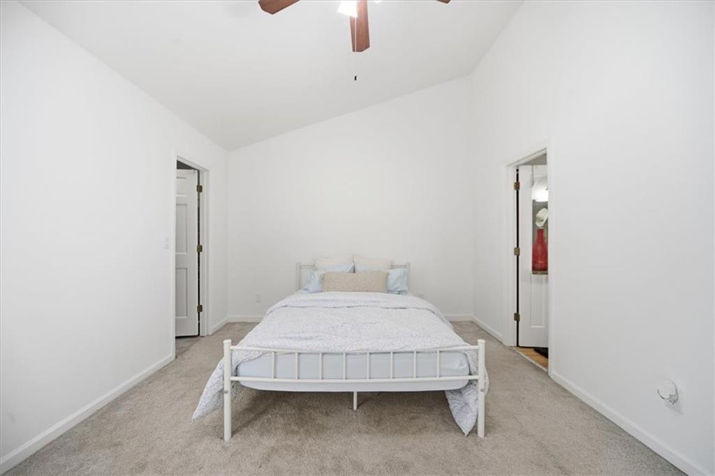 2215 Spring Walk Court Atlanta, GA 30341 - Photo 21 of 29 a bedroom with a bed and cabinets