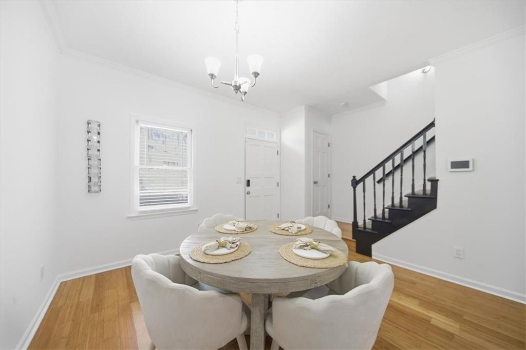 2215 Spring Walk Court Atlanta, GA 30341 - Photo 5 of 29 a view of a dining room with furniture and wooden floor