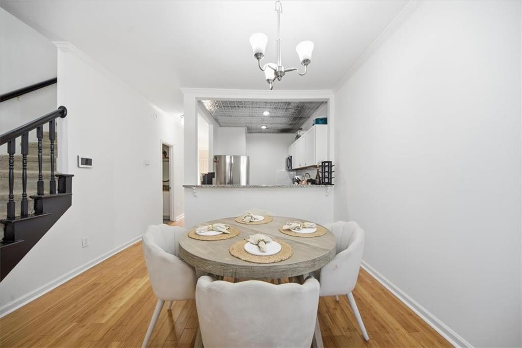 2215 Spring Walk Court Atlanta, GA 30341 - Photo 7 of 29 a view of a dining room with furniture and wooden floor