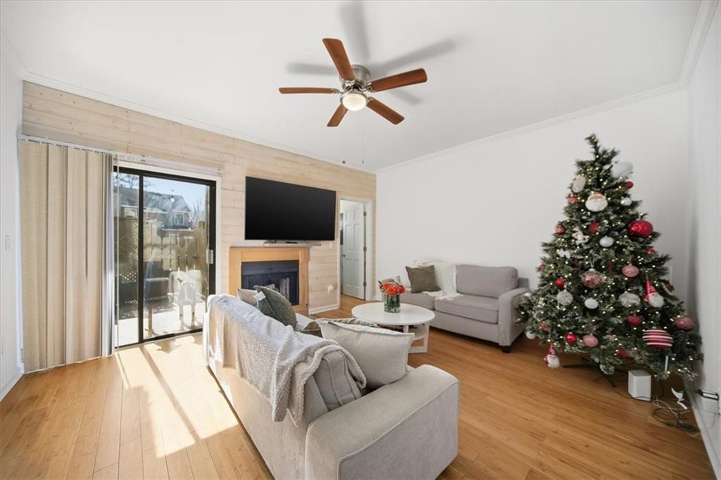 2215 Spring Walk Court Atlanta, GA 30341 - Photo 8 of 29 a living room with furniture or wooden floor and a large window