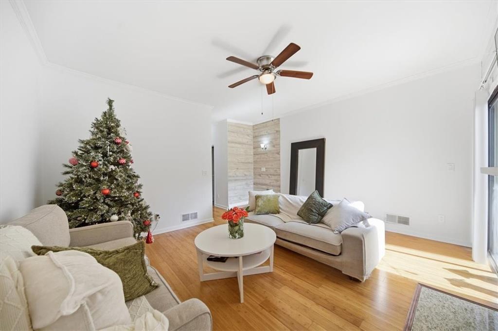 2215 Spring Walk Court Atlanta, GA 30341 - Photo 10 of 29 a living room with furniture and a potted plant