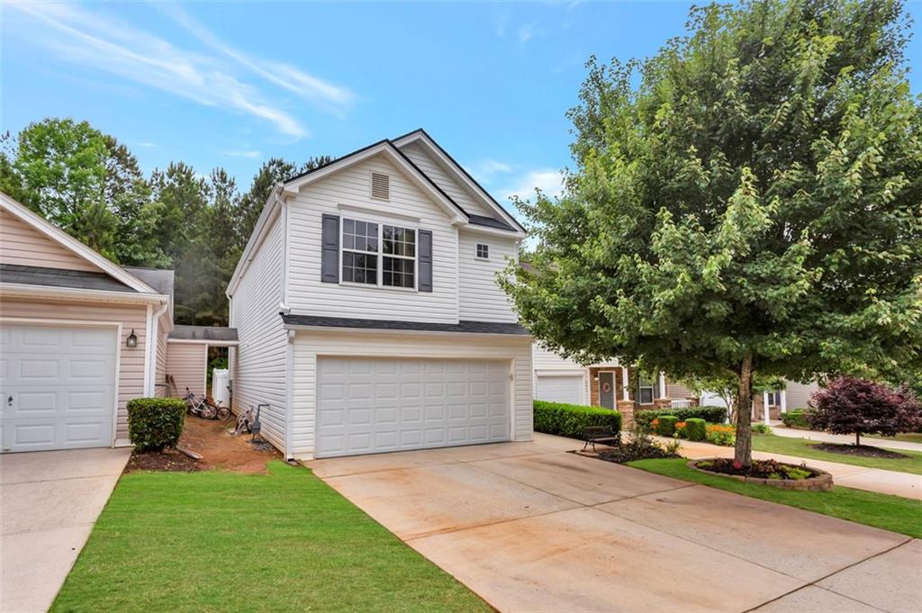 a front view of a house with a yard