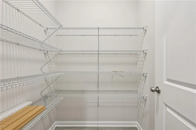 a bathroom with a sink toilet vanity and shower