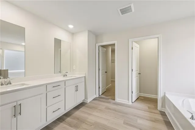 a bathroom with a bathtub and a shower