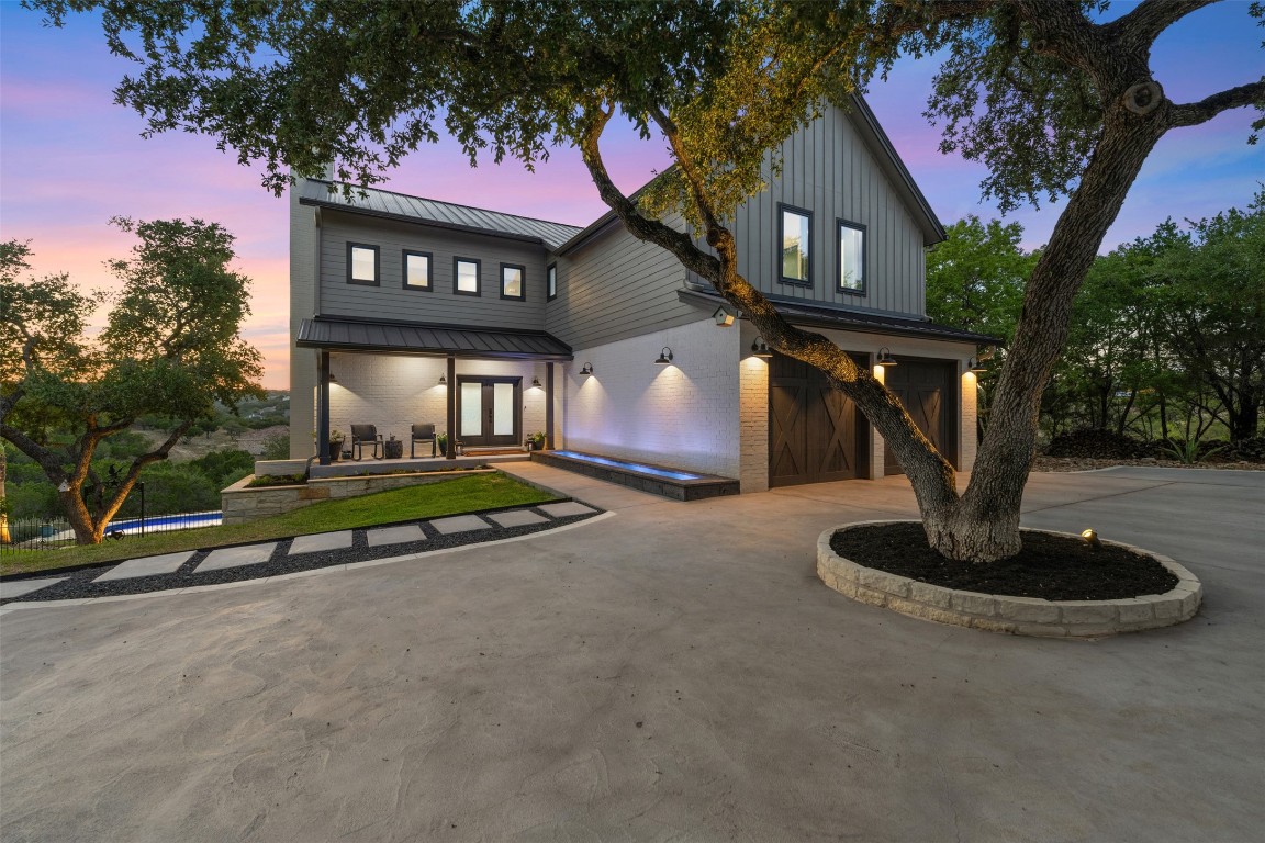 This home has fabulous curb appeal that provides an idyllic setting of majestic trees with sprawling branches framing the front of the home.