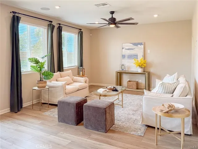 a living room with furniture and a large window