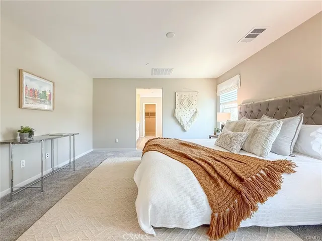 a white bath tub sitting next to a shower