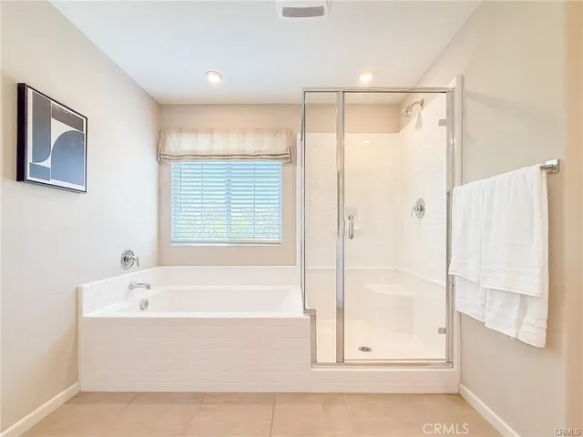 a view of a hallway with bathroom and a bathroom