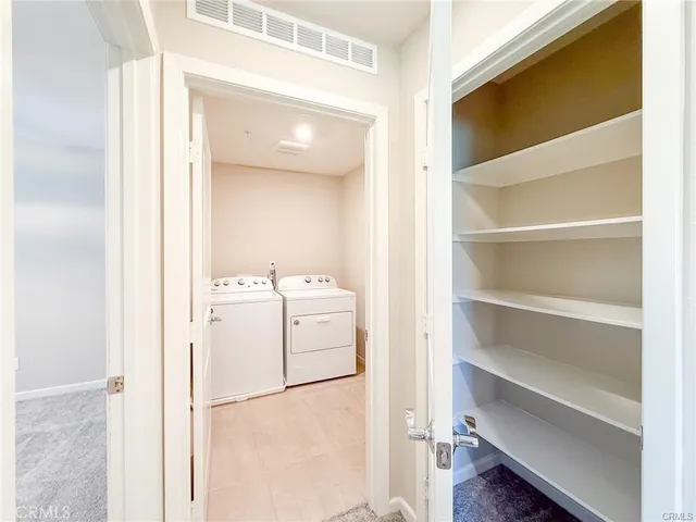 an aerial view of a residential houses with outdoor space