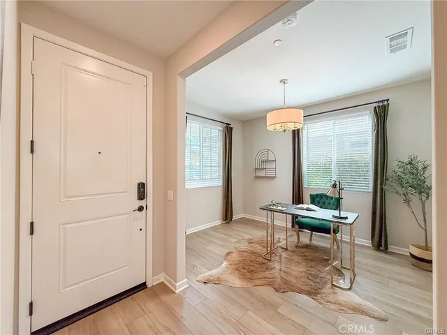 a bathroom with a sink toilet and a mirror
