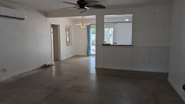 an empty room with a empty space and windows