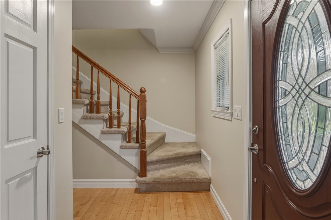 2304 Whiskey Creek Road Corning, NY 14830 - Photo 19 of 42 Just inside the front door is a coat closet and the steps to the second floor.
