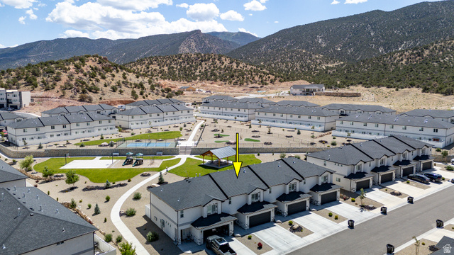 668 East Fiddlers Canyon Road, Unit 6 Cedar City, UT 84721 - Photo 31 of 36 Aerial perspective showcasing a modern townhome community with mountain backdrops