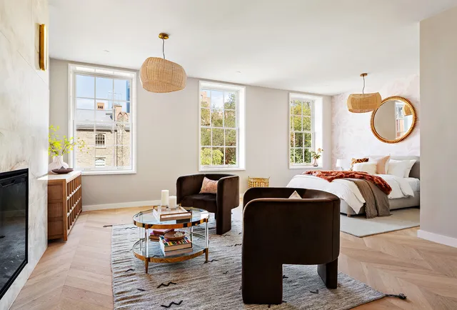 a spacious bedroom with a bed and a couch