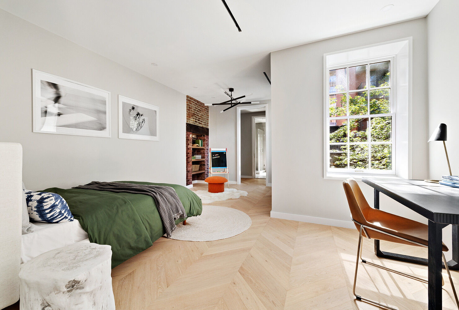 436 West 20th Street Manhattan, NY 10011 - Photo 13 of 24 a bedroom with a bed and a window