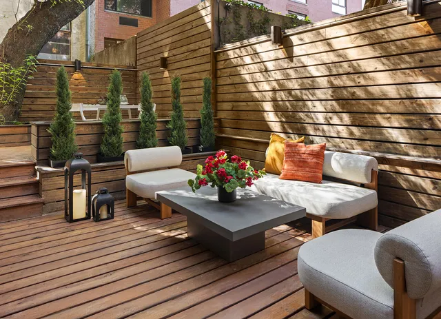 a building outdoor space with patio couch and chairs
