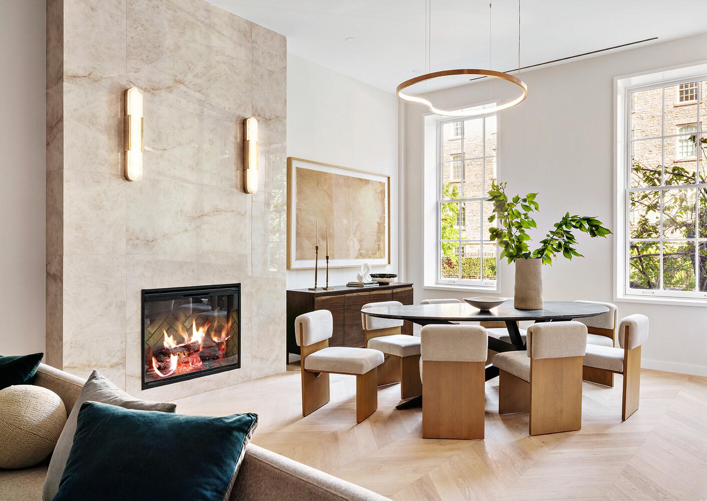 436 West 20th Street Manhattan, NY 10011 - Photo 2 of 24 a living room with furniture a chandelier and a fireplace