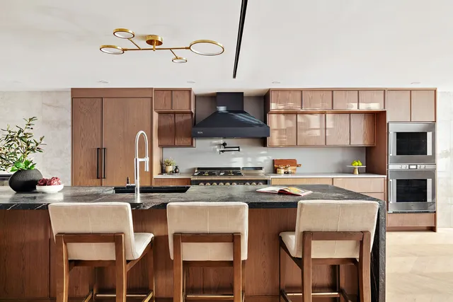a view of a dining room with furniture and a fireplace
