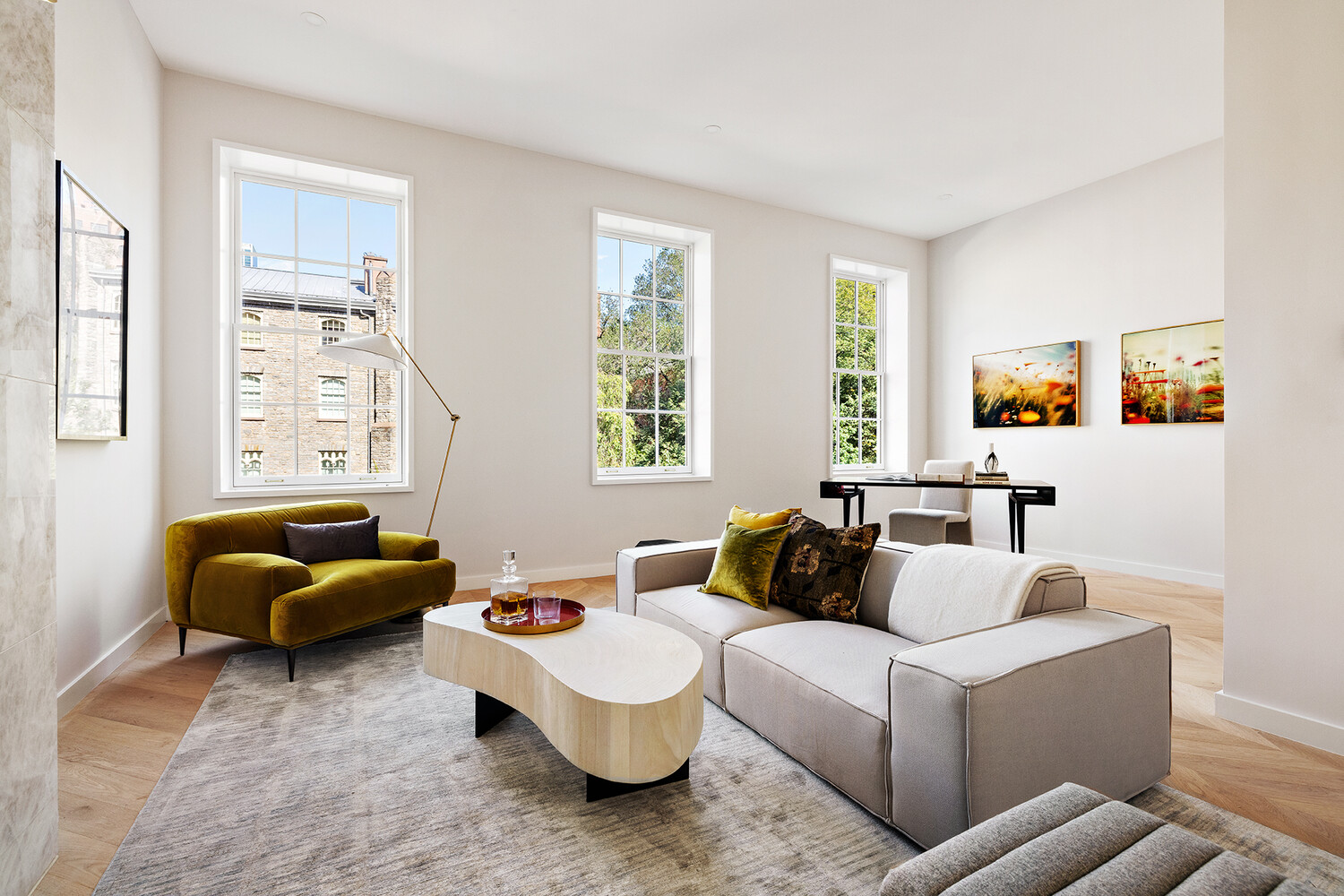 436 West 20th Street Manhattan, NY 10011 - Photo 7 of 24 a living room with furniture and a window