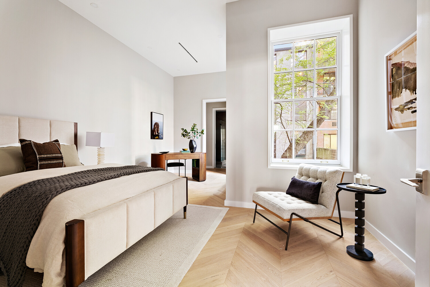 436 West 20th Street Manhattan, NY 10011 - Photo 9 of 24 a spacious bedroom with a bed and a couch