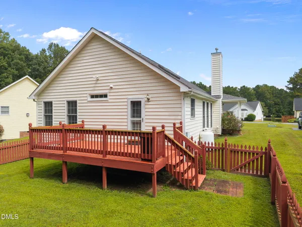 a view of a deck with a yard