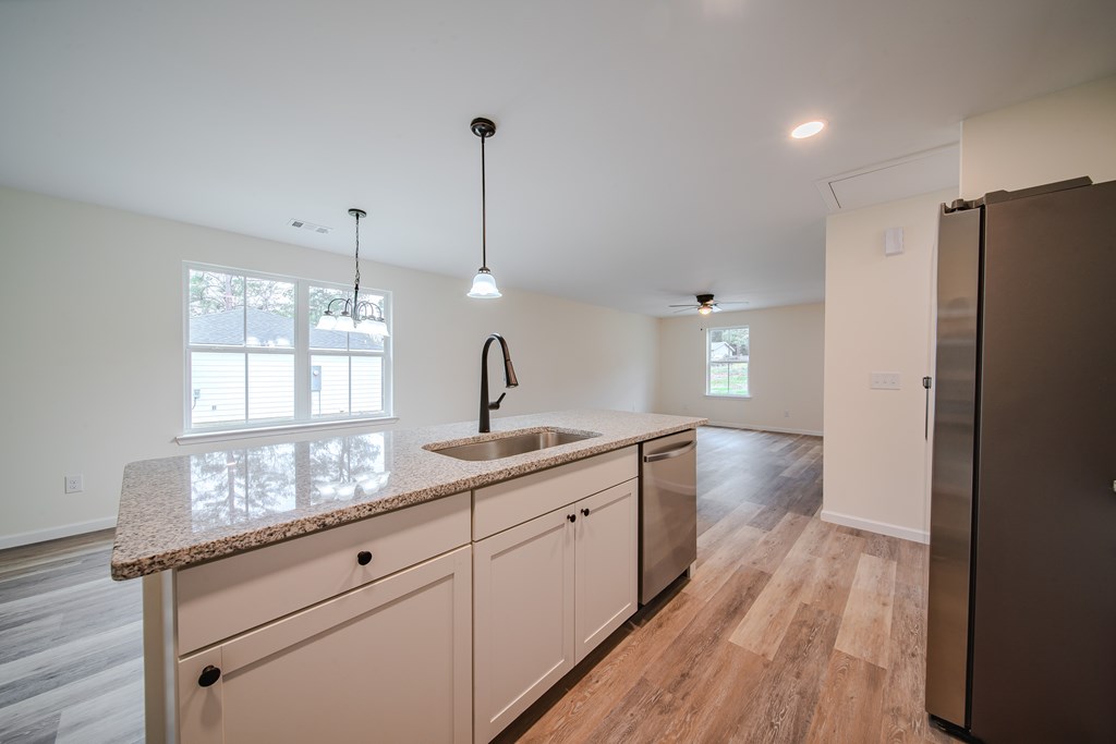 4396 Forrest Road Columbus, GA 31907 - Photo 11 of 24 a kitchen with sink refrigerator and window