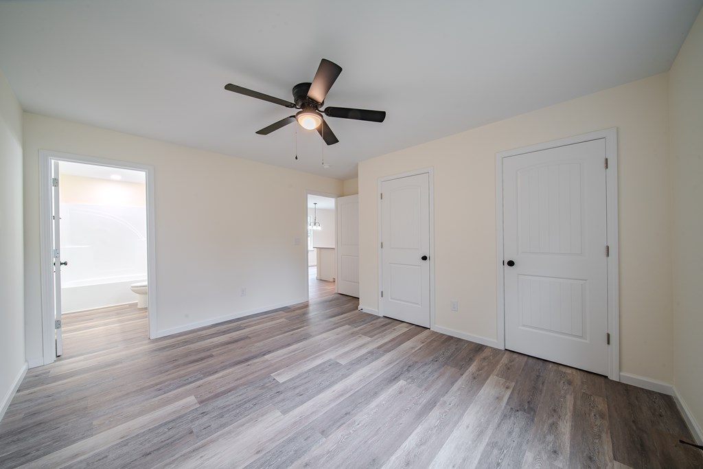 4396 Forrest Road Columbus, GA 31907 - Photo 15 of 24 a view of empty room with wooden floor and ceiling fan