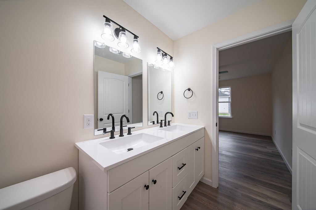 4396 Forrest Road Columbus, GA 31907 - Photo 17 of 24 a bathroom with a sink and a mirror
