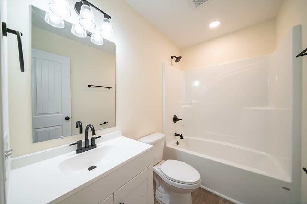 4396 Forrest Road Columbus, GA 31907 - Photo 20 of 24 a bathroom with a sink a toilet and shower