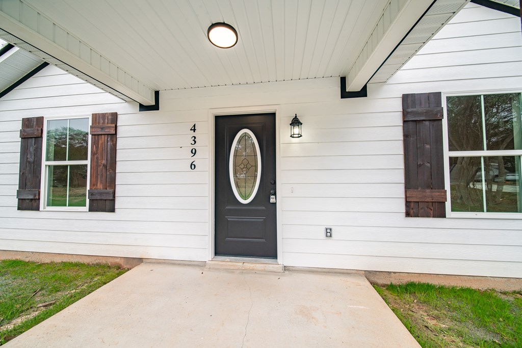 4396 Forrest Road Columbus, GA 31907 - Photo 4 of 24 a front view of a house with a garden
