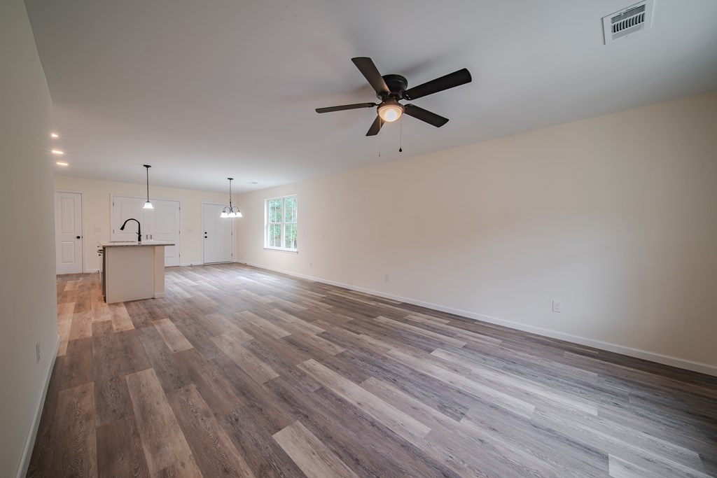 4396 Forrest Road Columbus, GA 31907 - Photo 6 of 24 a view of empty room with wooden floor and window