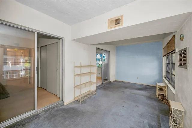 a living room with lots of furniture and a chandelier